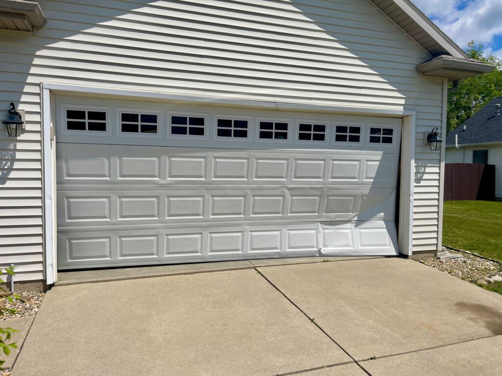 Damaged-Garage-Door-Before-Replacement-–-New-Carlisle-IN
